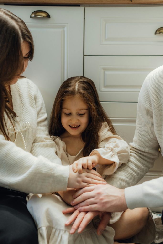 A group of people sitting around each other